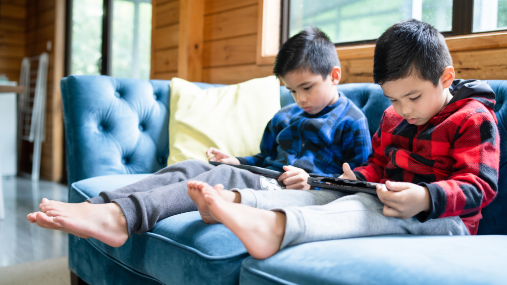 Two young children on screens