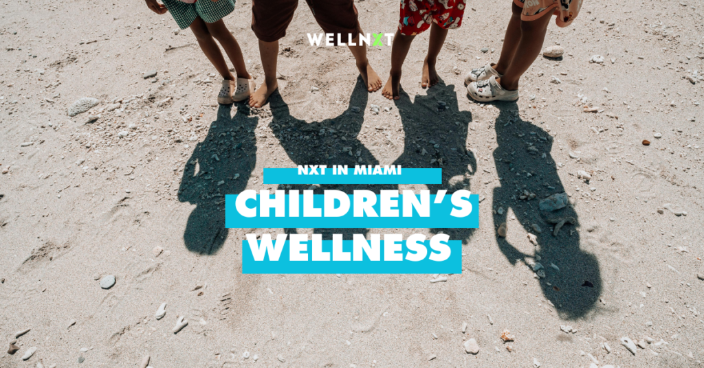 children's feet on a beach